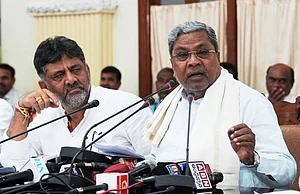 PTI : Karnataka CM Siddaramaiah (R) with his deputy DK Shivakumar (L) |